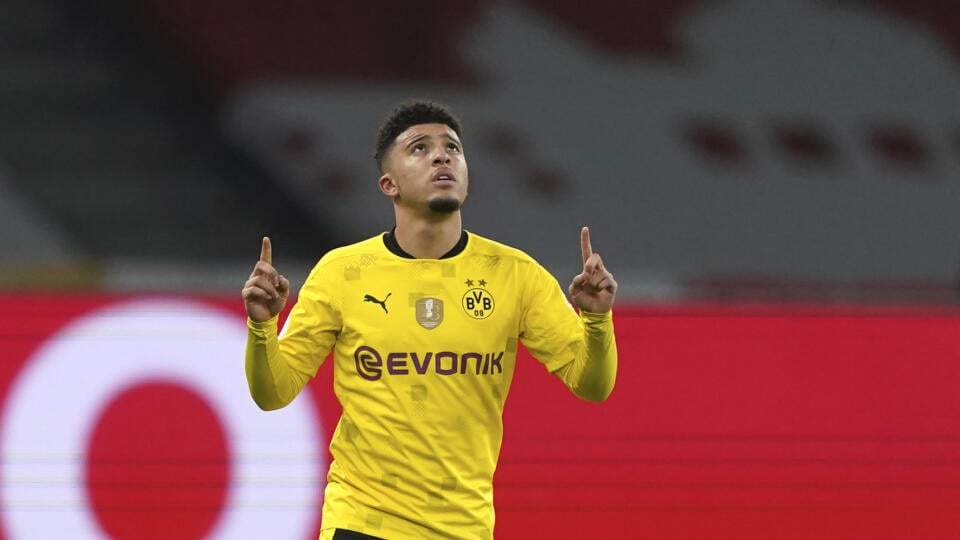 WA 49 Berlín - Futbalista Dortmundu Jadon Sancho sa teší po strelení gólu vo finálovom zápase Nemeckého pohára RB Lipsko - Borussia Dortmund v Berlíne vo štvrtok 13. mája 2021. FOTO TASR/AP  

Dortmund's Jadon Sancho celebrates after scoring his side's opening goal during the German soccer cup (DFB Pokal) final match between RB Leipzig and Borussia Dortmund in Berlin, Germany, Thursday, May 13, 2021. (AP Photo/Michael Sohn, Pool)