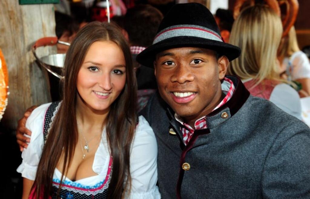 David Alaba of Bayern Muenchen from Austria and his girlfriend Katja Butylina attend the Oktoberfest beer festival in Munich southern Germany, Sunday, Oct 6, 2013. (AP Photo/Lennart Preiss/Bongarts, Pool)