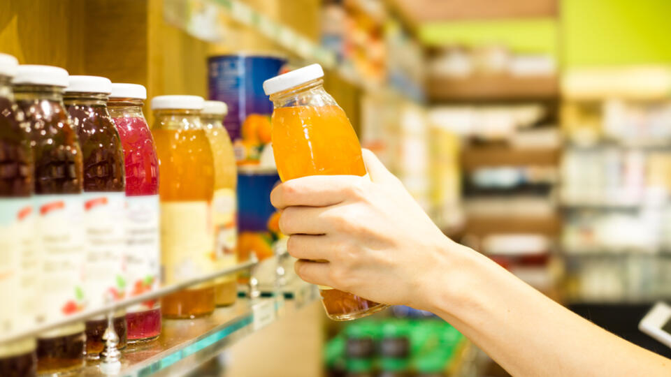 Juices,And,Drinks.,Female,Hands,Holding,A,Bottle,Of,Juice