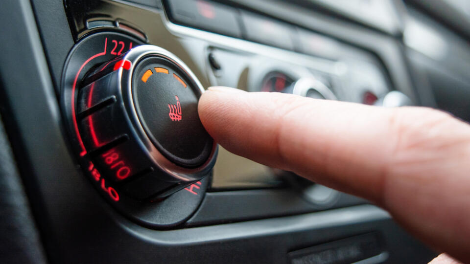 Button,For,Heating,The,Car,Seats,Close-up.,The,Male,Hand