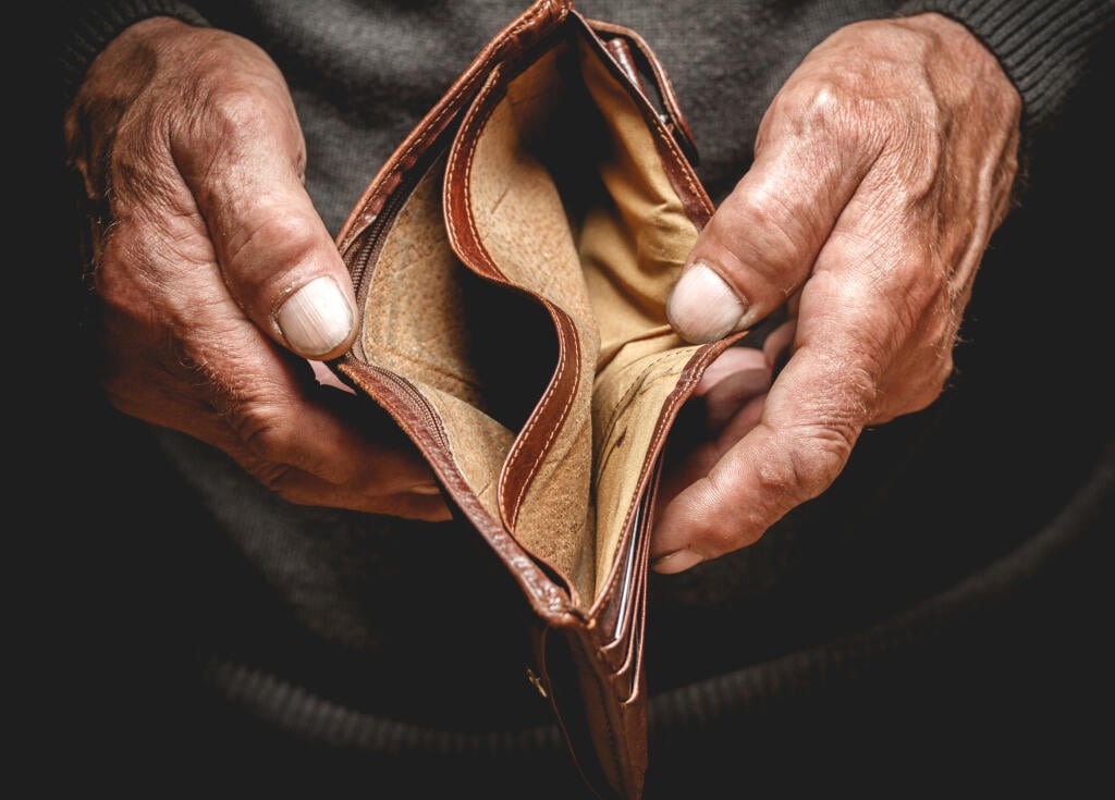 Empty,Wallet,In,The,Hands,Of,An,Elderly,Man.,Poverty