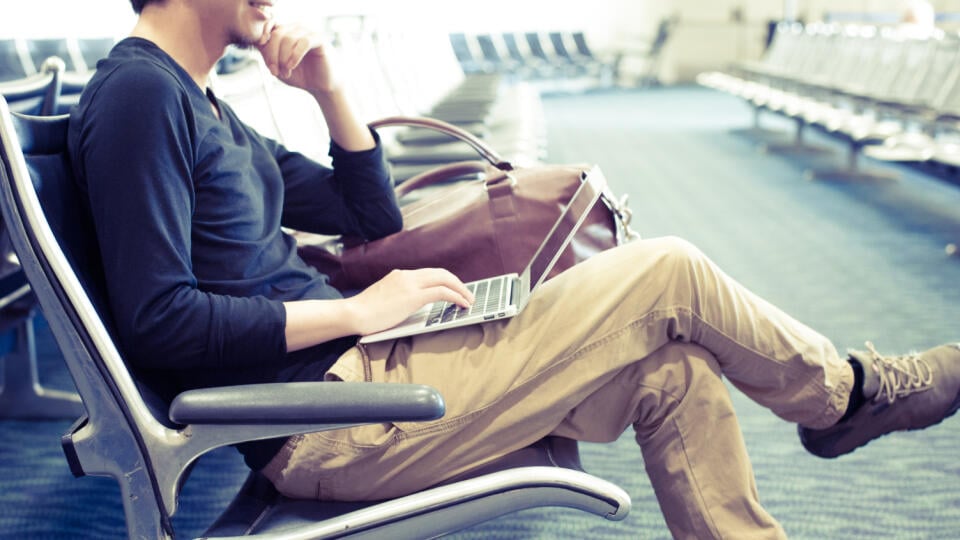 Men,Using,A,Laptop,In,The,Waiting,Room,Of,The