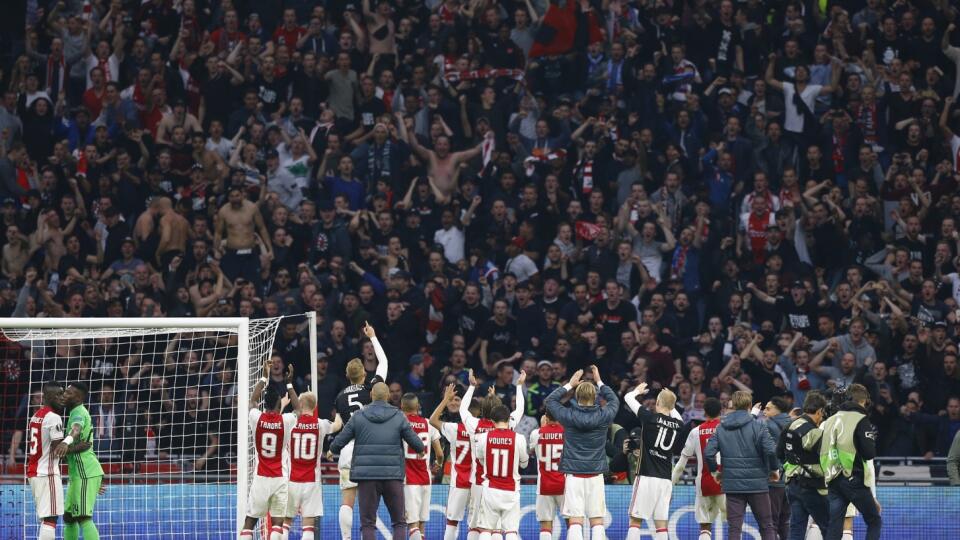 Ajax players celebrate after the match