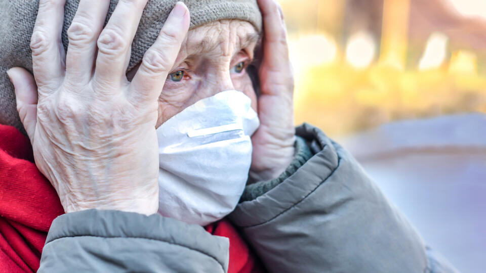 An,Elderly,Old,Woman,In,A,Protective,Respirator,Mask,On