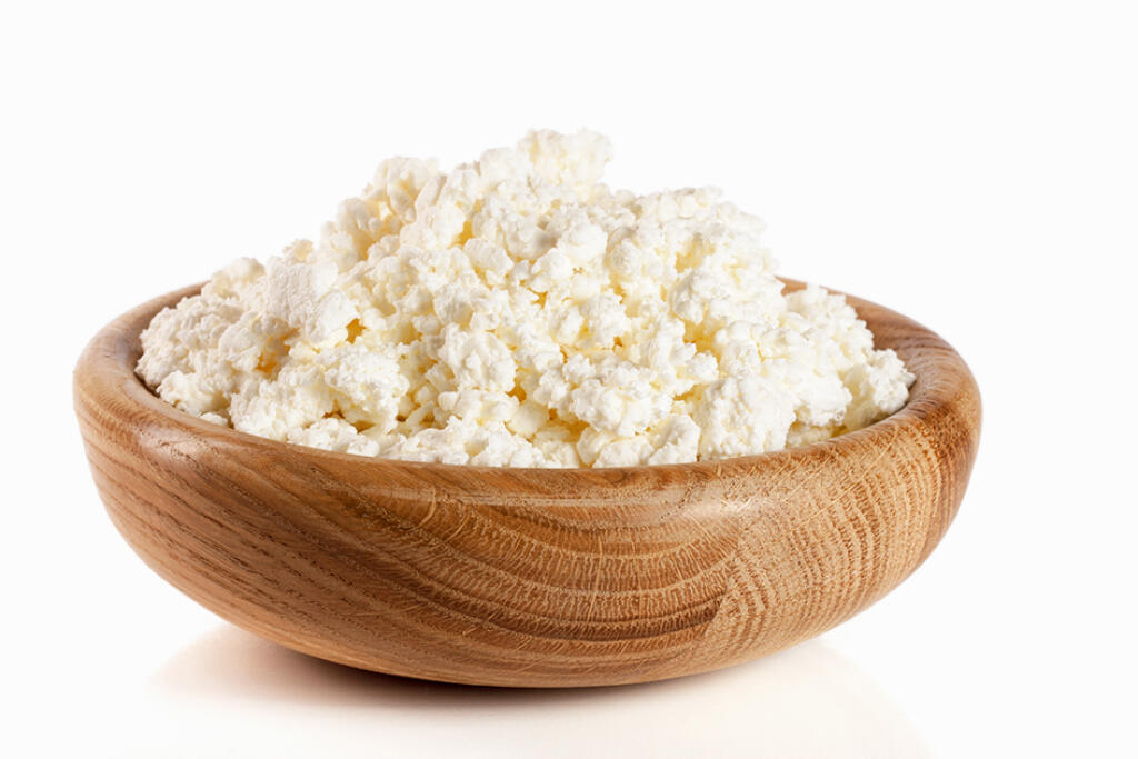 Cottage,Cheese,In,A,Wooden,Bowl,Isolated,On,A,White
