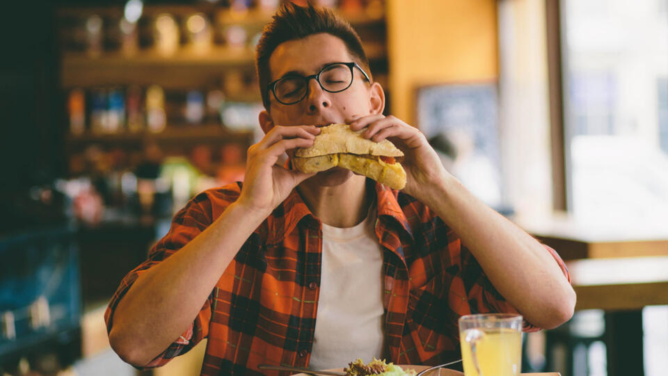 Man,Is,Eating,In,A,Restaurant,And,Enjoying,Delicious,Food