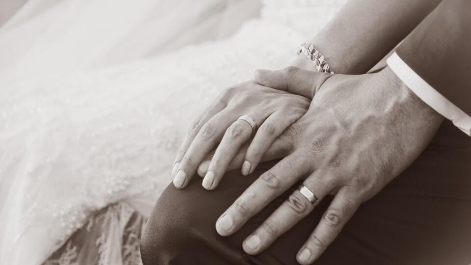 Newly wed couple's hands with wedding rings (Sepia tones)
