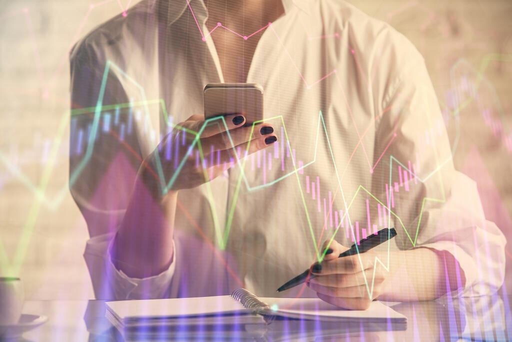 Double,Exposure,Of,Financial,Graph,Sketch,Hologram,And,Woman,Holding