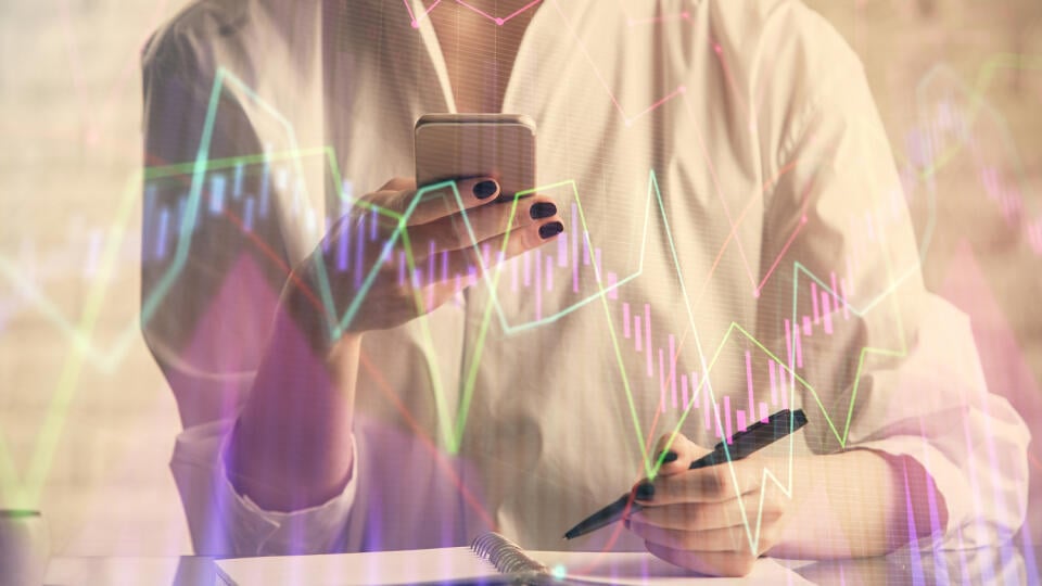 Double,Exposure,Of,Financial,Graph,Sketch,Hologram,And,Woman,Holding