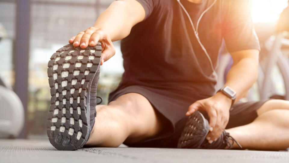 Shot,Of,A,Young,Man,Stretching,His,Legs,Before,A