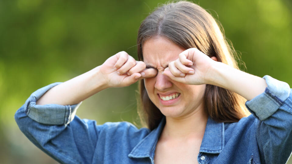 Woman,Suffering,Itching,Scratching,Eyes,Outdoors,In,A,Park