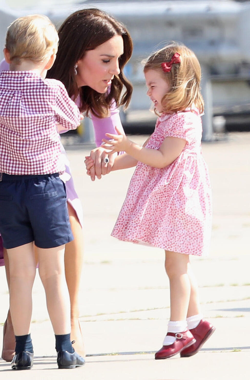 HAMBURG, GERMANY - JULY 21: Prince William, Duke of Cambridge, Catherine, Duchess of Cambridge, Prince George of Cambridge and Princess Charlotte of Cambridge view helicopter models H145 and H135 before departing from Hamburg airport on the last day of their official visit to Poland and Germany on July 21, 2017 in Hamburg, Germany. (Photo by Chris Jackson/Getty Images)