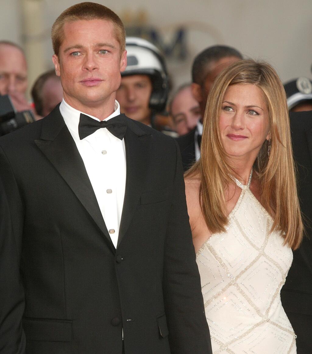 CANNES, FRANCE - MAY 13: Actor Brad Pitt and wife actress Jennifer Aniston attend the World Premiere of the epic movie