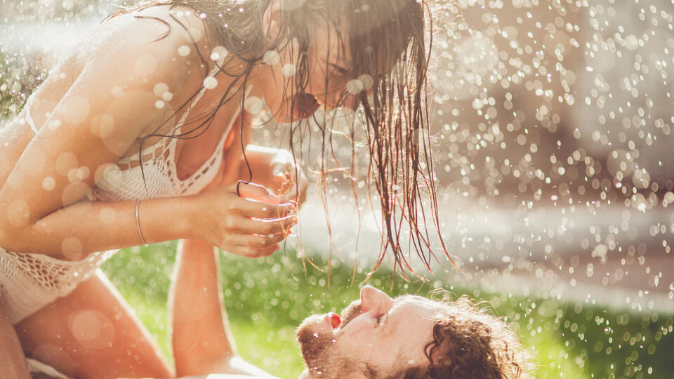 Young,Couple,Hugging,And,Under,A,Rain,,In,Passion,,Outdoor