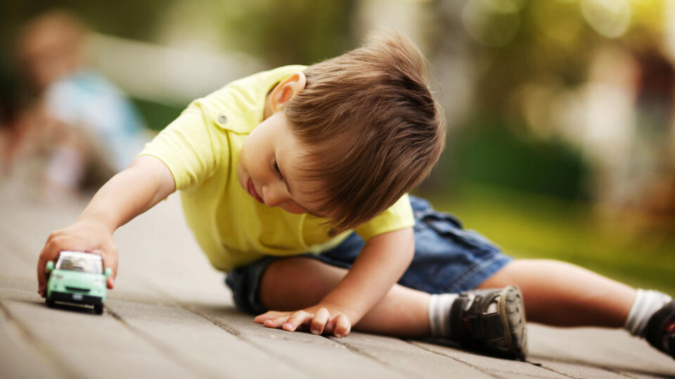 Little,Boy,Plays,With,Toy,Car