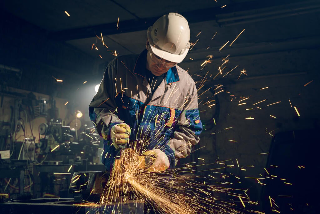 Locksmith,In,Special,Clothes,And,Goggles,Works,In,Production.,Metal