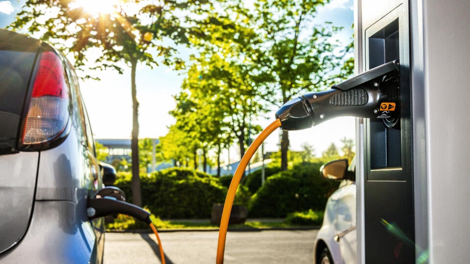 Electric,Car,On,A,Charging,Station,With,Back,And,Light