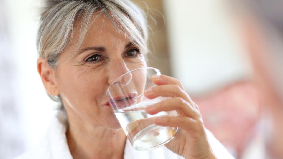 Senior,Woman,Drinking,Water,In,The,Morning