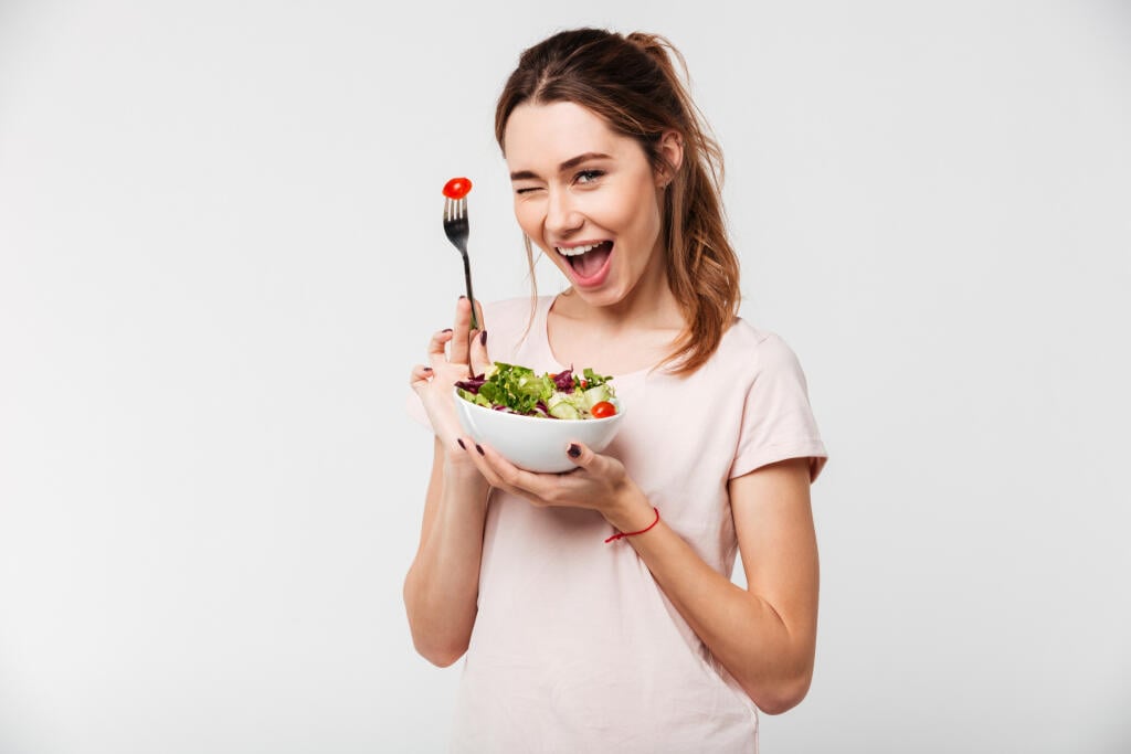 Portrait,Of,A,Happy,Playful,Girl,Eating,Fresh,Salad,From