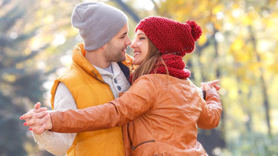 Portrait of young couple in autumn park
