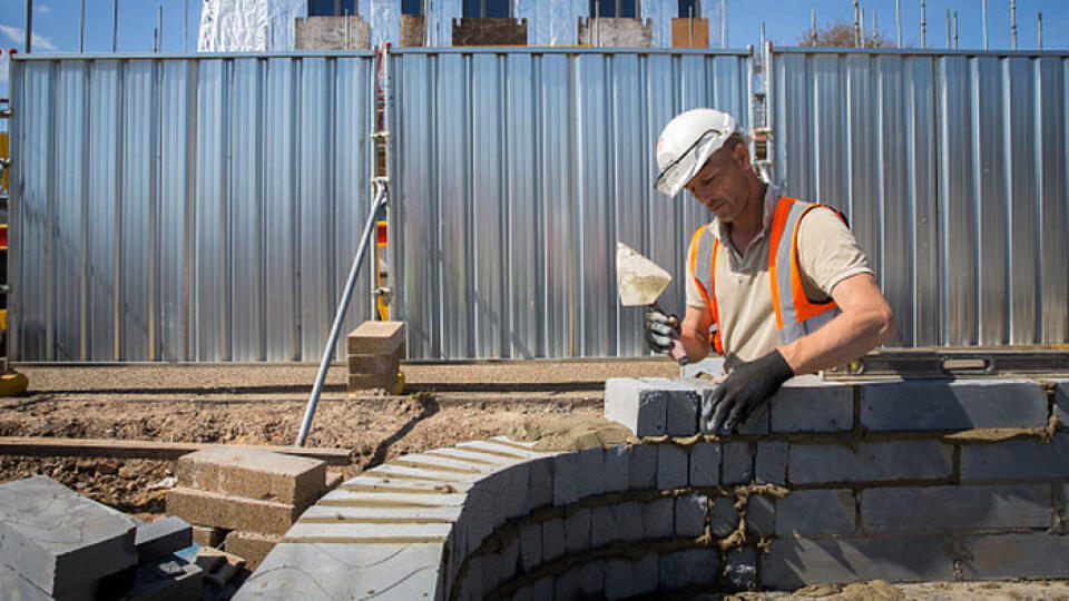 A builder uses a trowel and a spirit level to lay the first bricks with cement onto the foundations of a new house on a home building construction site in Norwich. Norfolk. United Kingdom (photo by Andrew Aitchison / In pictures via Getty Images)