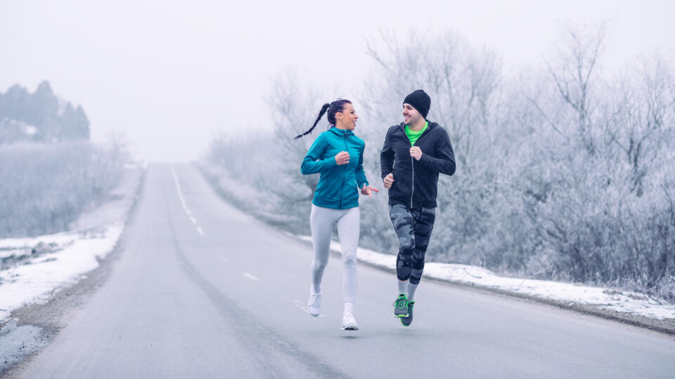 Full,Length,Portrait,Of,A,Young,Couple,Running,On,An