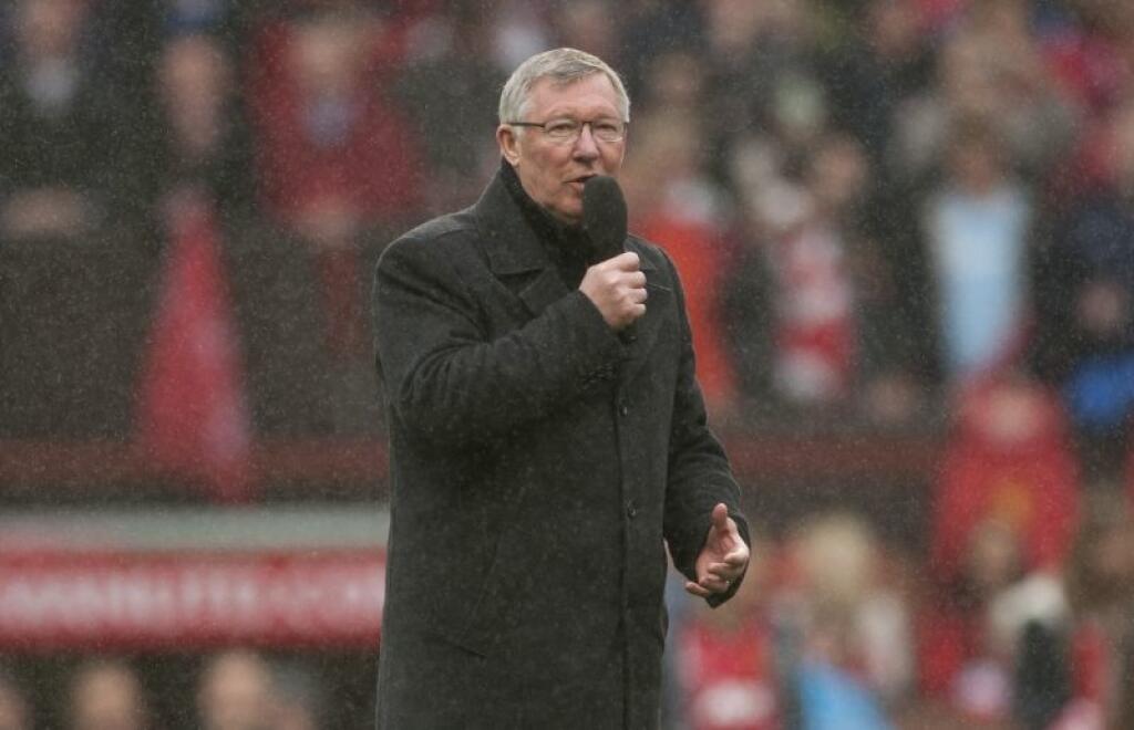Manchester United's manager Sir Alex Ferguson speaks to the crowd after his last home game in charge of the club, their English Premier League soccer match against Swansea City, at Old Trafford Stadium, Manchester, England, Sunday May 12, 2013. (AP Photo/Jon Super)