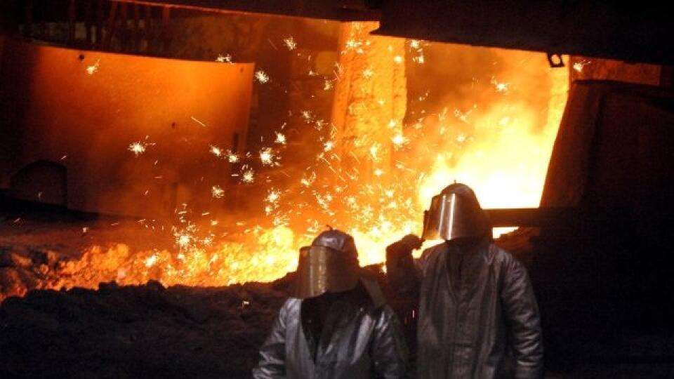In the picture, pig iron tapping in operation of the Vysoké pece in USSteel Košice.  Demanding working conditions require special protective clothing and compliance with a regular drinking regimen.  Pig iron reaches a temperature of 1470 degrees Celsius when tapped.  July 27, 2007. PHOTO TASR - František Iván