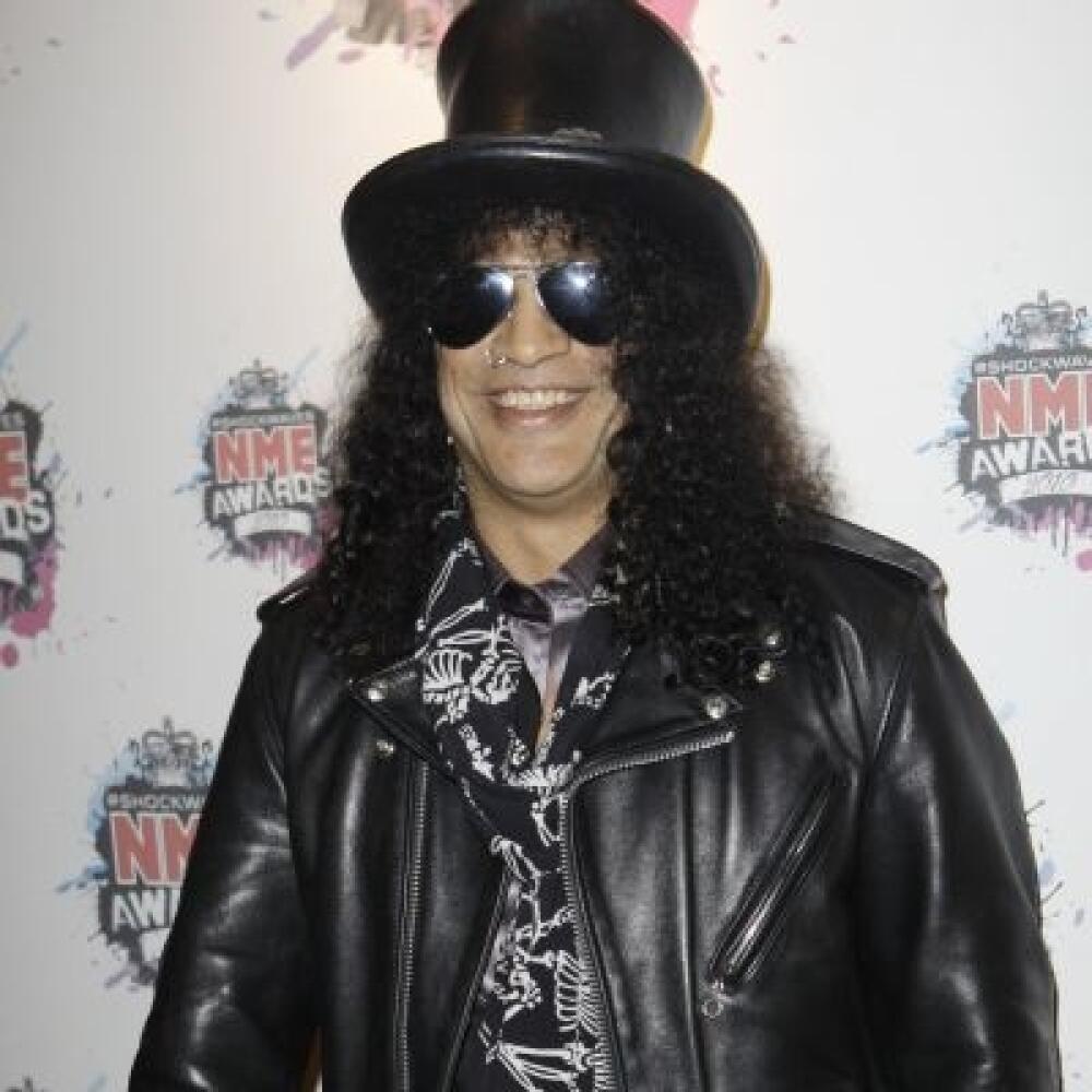 U.S guitarist Slash arrives for the NME 2010 awards in south London, Wednesday, Feb. 24, 2010. (AP Photo/Joel Ryan)