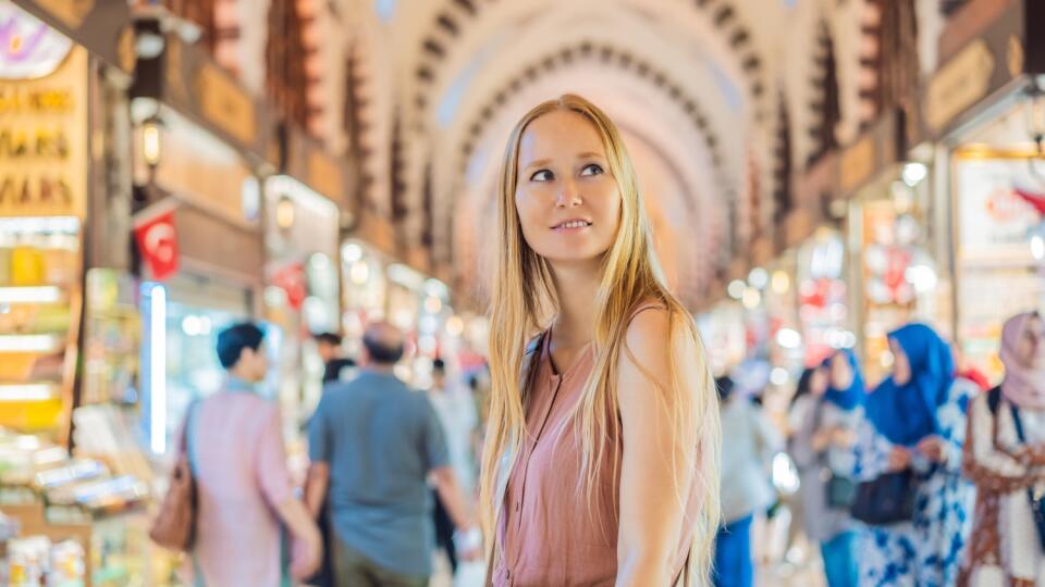 A,Tourist,Woman,Walks,Among,The,Countless,Shops,At,The