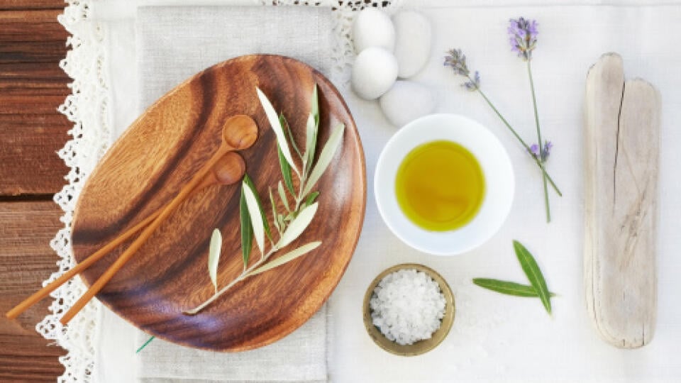 Organic oil and salt with lavender on table cloth