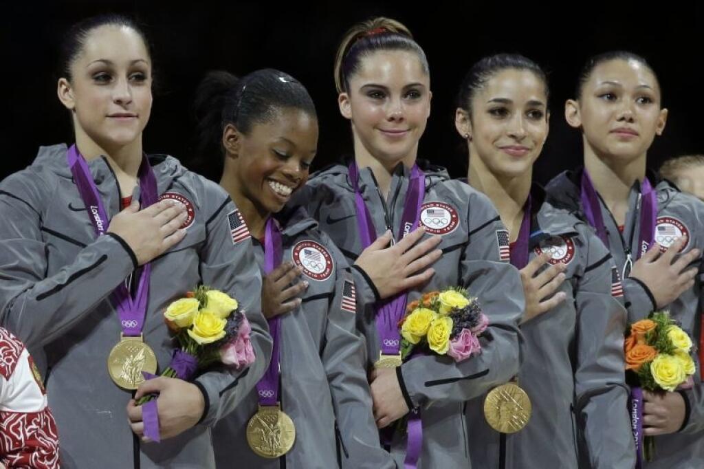 U.S. gymnasts, left to right, Jordyn Wieber, Gabrielle Douglas, McKayla Maroney, Alexandra Raisman and Kyla Ross stand for their national anthem, during the Artistic Gymnastics women's team final at the 2012 Summer Olympics, Tuesday, July 31, 2012, in London. (AP Photo/Julie Jacobson)