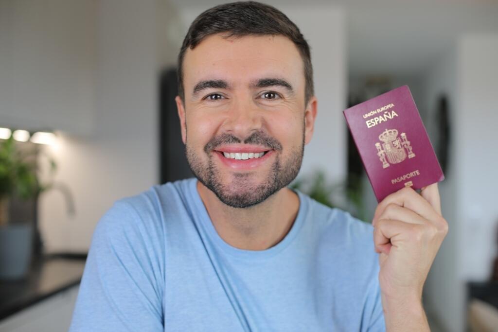 Man holding a Spanish passport