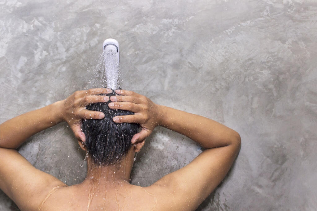 Man,Taking,A,Shower,To,Cleanse,The,Body,After,Tired