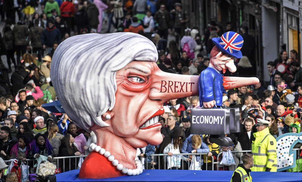 A carnival float depicts British Prime Minister Theresa May and the Brexit during the traditional carnival parade in Duesseldorf, Germany, on Monday, March 4, 2019. The foolish street spectacles in the carnival centers of Duesseldorf, Mainz and Cologne, watched by hundreds of thousands of people, are the highlights in Germany's carnival season on Rosemonday. (AP Photo/Martin Meissner)