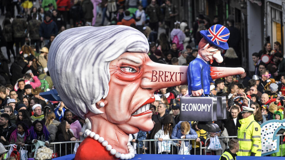 A carnival float depicts British Prime Minister Theresa May and the Brexit during the traditional carnival parade in Duesseldorf, Germany, on Monday, March 4, 2019. The foolish street spectacles in the carnival centers of Duesseldorf, Mainz and Cologne, watched by hundreds of thousands of people, are the highlights in Germany's carnival season on Rosemonday. (AP Photo/Martin Meissner)