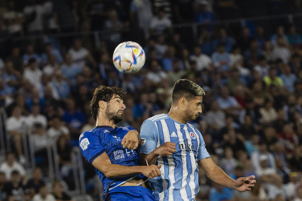 Na snímke Eric Ramirez a Mamuka Kobakhidze počas prvého zápasu prvého predkola UEFA Ligy Majstrov 2022/23 medzi ŠK Slovan Bratislava a FC Dinami Batumi.