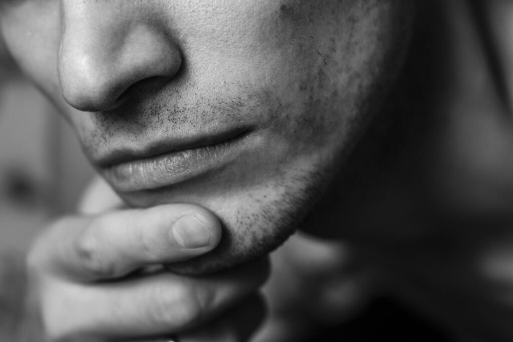 Close,Up,Of,Male,Bottom,Part,Of,Face,With,Hand.