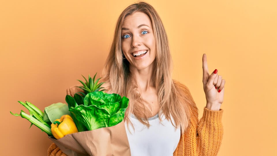 Beautiful,Caucasian,Woman,Holding,Paper,Bag,With,Bread,And,Groceries