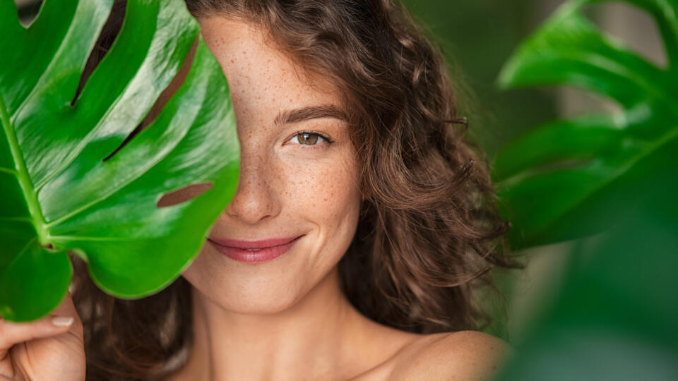 Close,Up,Face,Of,Beautiful,Young,Woman,Covering,Her,Face