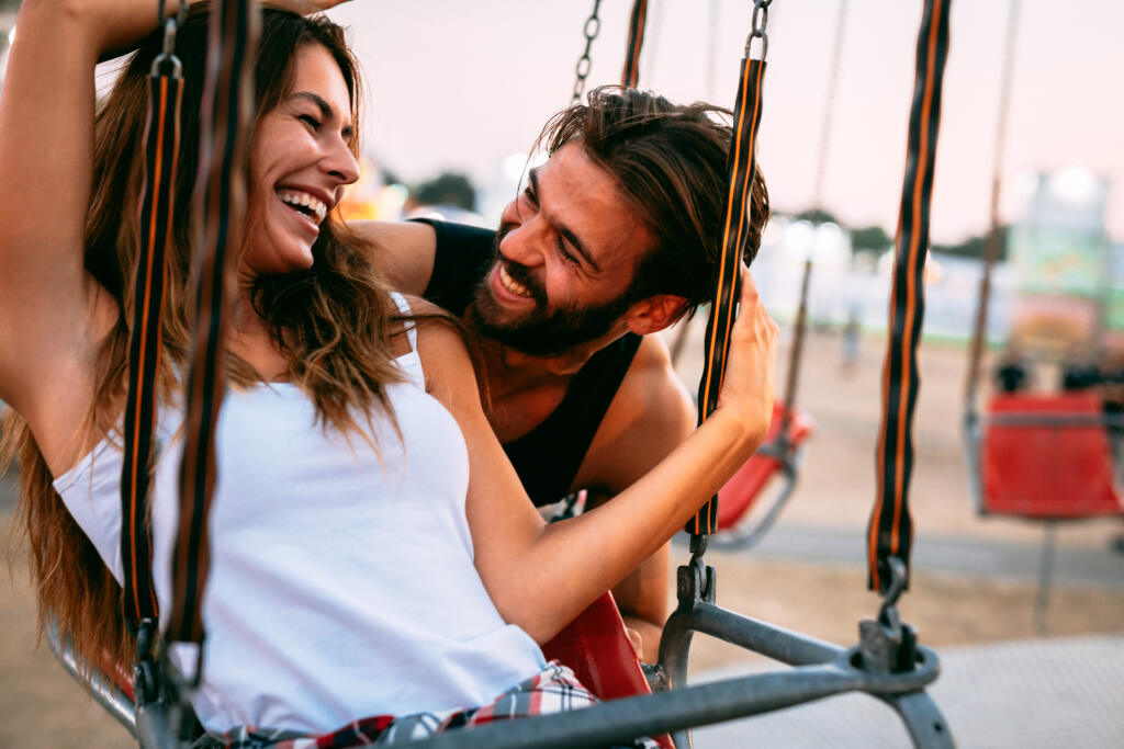 Beautiful,Happy,Couple,At,Amusement,Park.,Soft,Focus,,High,Iso,