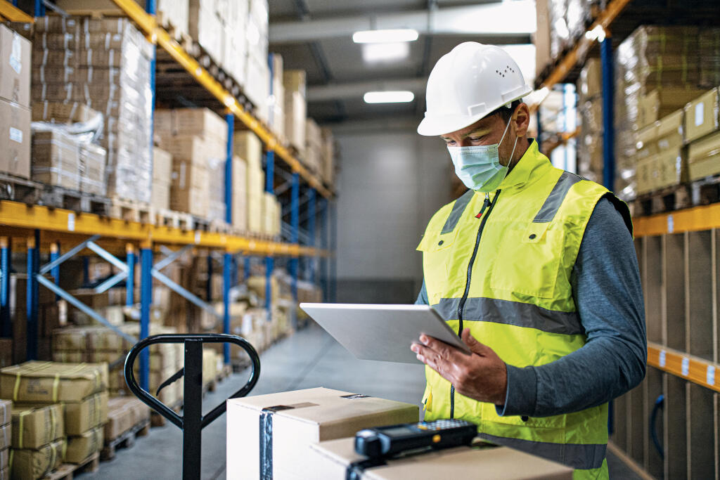 Man,Worker,With,Tablet,Working,Indoors,In,Warehouse,,Coronavirus,Concept.