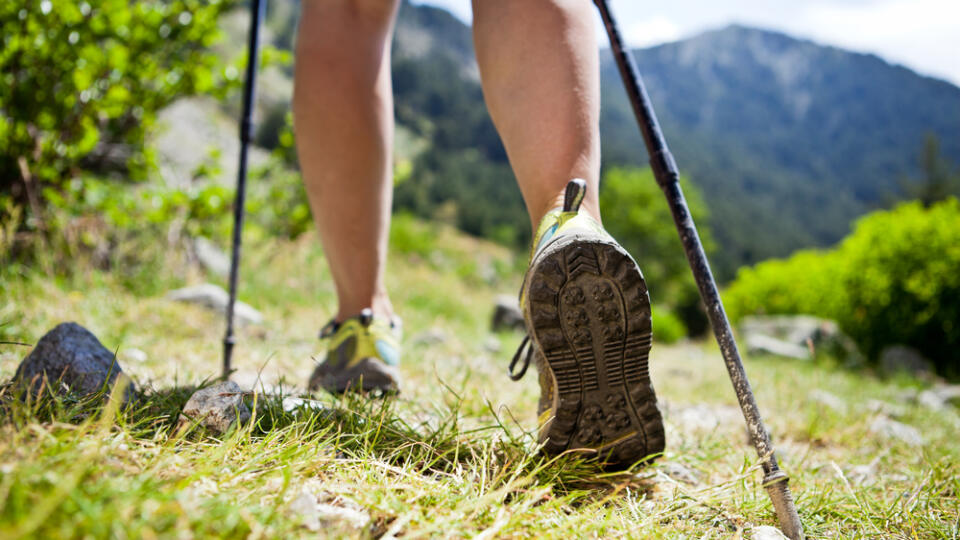 Woman,Hiking,In,Mountains,,Adventure,And,Exercising.,Legs,And,Nordic