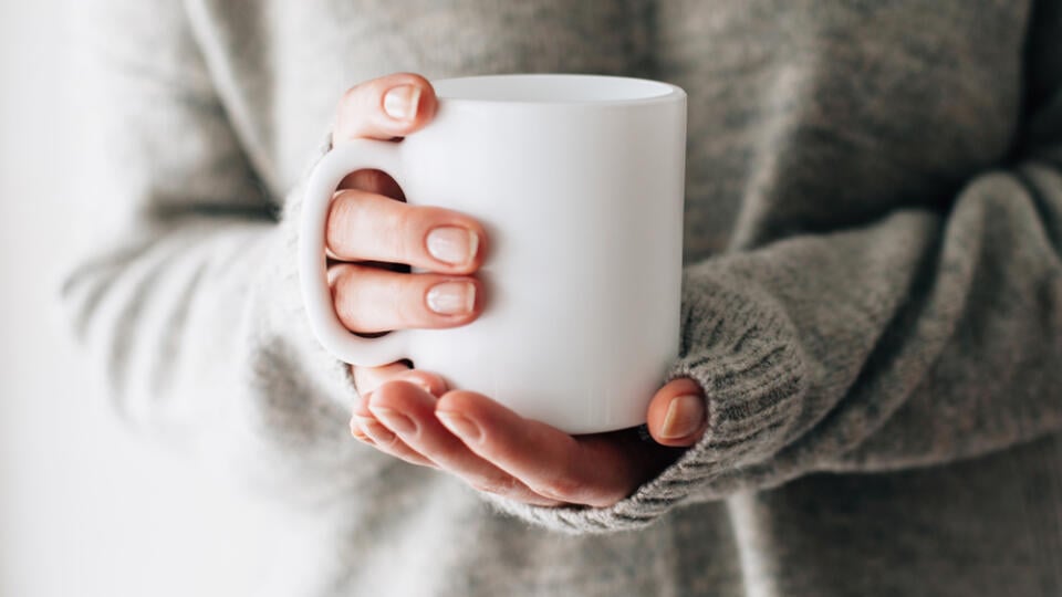 Closeup,Of,Female,Hands,With,A,Mug,Of,Beverage.,Beautiful