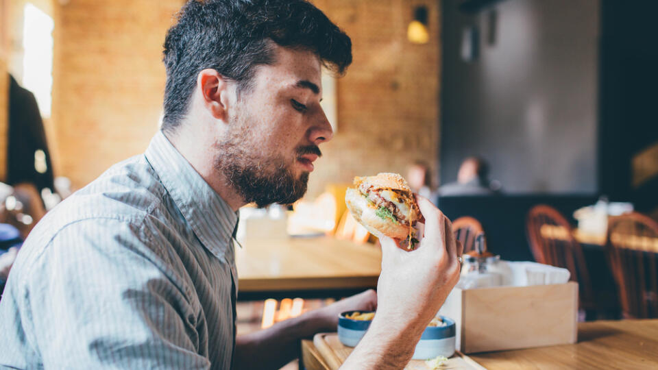 Man,Is,Eating,In,A,Restaurant,And,Enjoying,Delicious,Food