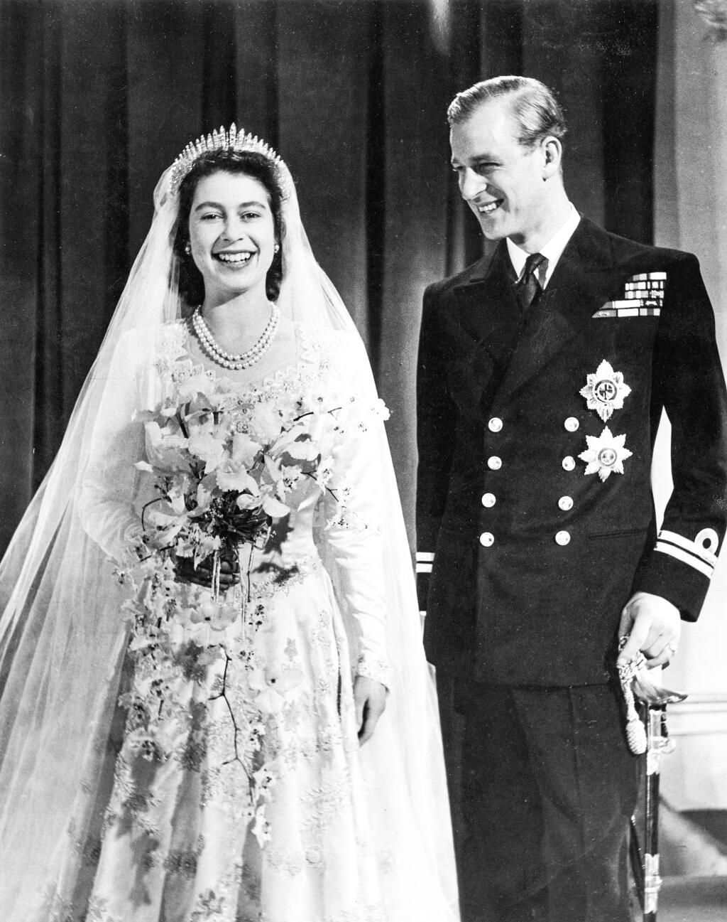 Princess Elizabeth (Queen Elizabeth II) and Prince Philip, Duke of Edinburgh (formerly Lieutenant Philip Mountbatten) pose together for an official photograph following their marriage at Westminster Abbey on 20 November 1947.,Image: 164885509, License: Rights-managed, Restrictions: , Model Release: no
