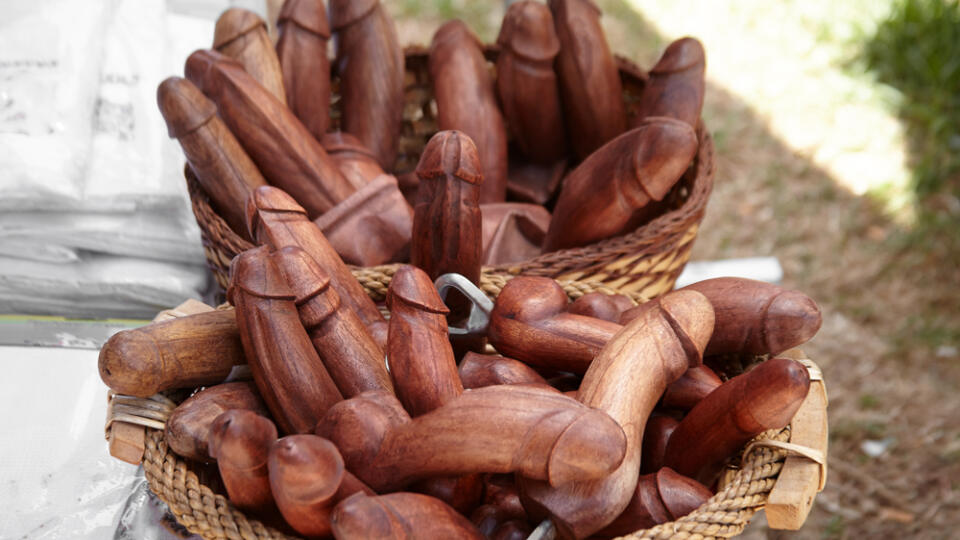 Wooden,Penises,Figures,Souvenir,,Bottle,Opener,,Being,Sold,To,Tourists