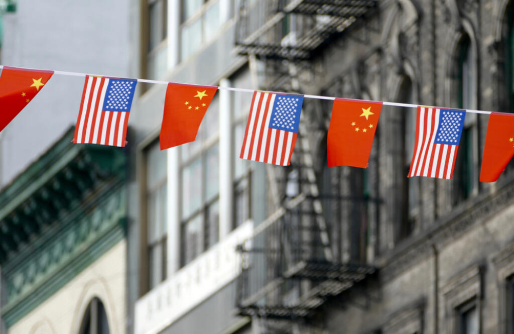 Flags,Of,Usa,And,China,Hanging,Next,To,Each,Other