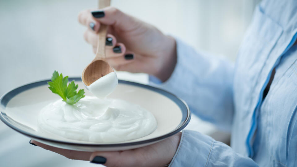 A,Cup,Of,Fresh,Yogurt,In,Young,Woman's,Hands