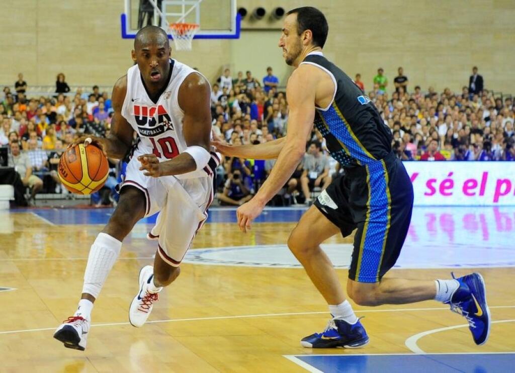 Kobe Bryant of the US Men's Senior National Team drives for the ball against Emmanuel Ginobili of the Argentina Men's Senior National Team during their Pre-Olympic friendly basketball match at the Palau Sant Jordi in Barcelona, Spain, Sunday, July 22, 2012. (AP Photo/Manu Fernandez)